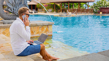 Businessman Working By Pool